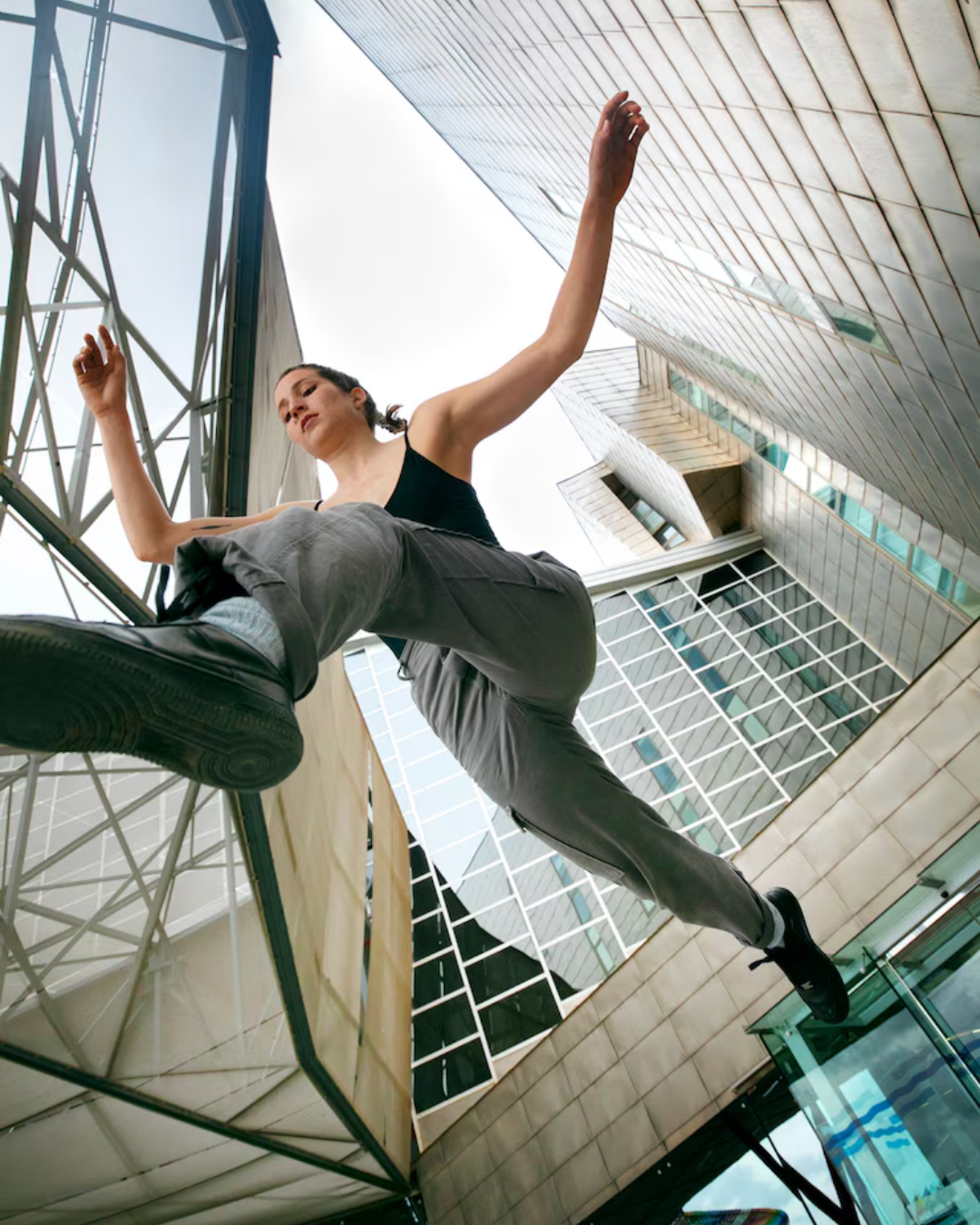 "Fearful person looking down from a tall building, symbolizing acrophobia"